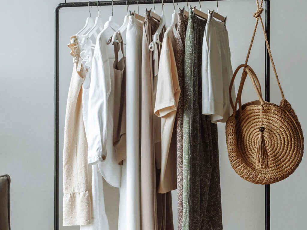 summer clothes that are hanging in a sustainable wardrobe